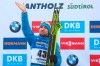 Russia's Alexander Loginov celebrates on the podium after winning the men's 10km sprint competition at the Biathlon World Championships in Antholz, Italy, Saturday, Feb. 15, 2020. (AP Photo/Matthias Schrader)