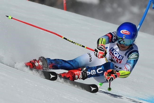United States' Mikaela Shiffrin speeds down the course during a women's giant slalom, at the alpine ski World Championships, in Cortina d'Ampezzo, Italy, Thursday, Feb. 18, 2021. (AP Photo/Marco Tacca)