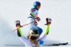 Switzerland's Lara Gut-Behrami celebrates winning the gold medal as United States' Mikaela Shiffrin comes in second in a women's giant slalom, at the alpine ski World Championships, in Cortina d'Ampezzo, Italy, Thursday, Feb. 18, 2021. (AP Photo/Marco Tacca)