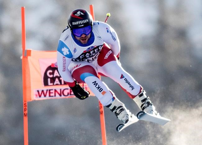 Switzerland's Beat Feuz in action during the men's downhill race run at the Alpine Skiing FIS Ski World Cup in Wengen, Switzerland, Saturday, Jan. 18, 2020. (Marcel Bieri/Keystone via AP)