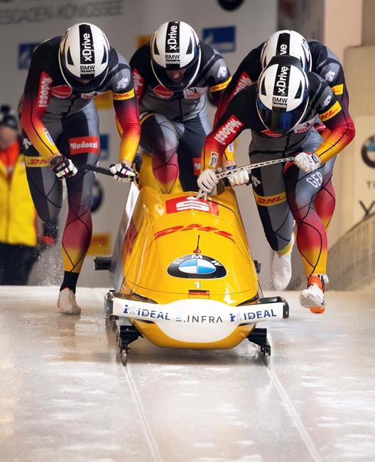 Francesco Friedrich, Candy Bauer, Martin Grothkopp and Alexander Schueller from Germany in action in the first run of the four-men bob world cup in Schoenau, Germany, Sunday, Jan.26, 2020. ( Sven Hoppe/dpa via AP)