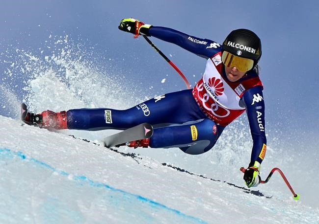 Sofia Goggia of Italy in action during the women's downhill race at the FIS Alpine Ski World Cup in Crans-Montana, Switzerland, Friday, Jan. 22, 2021. (Jean-Christophe Bott/Keystone via AP)