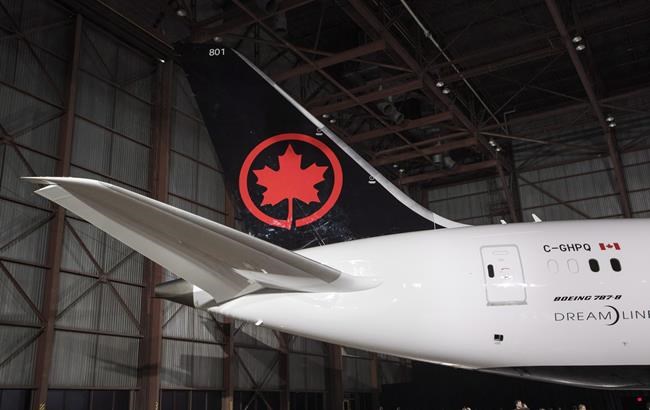 The tail of the newly revealed Air Canada Boeing 787-8 Dreamliner aircraft is seen at a hangar at the Toronto Pearson International Airport in Mississauga, Ont., Thursday, February 9, 2017. Air Canada says it is indefinitely suspending service on 30 domestic regional routes and closing eight stations at regional airports. THE CANADIAN PRESS/Mark Blinch