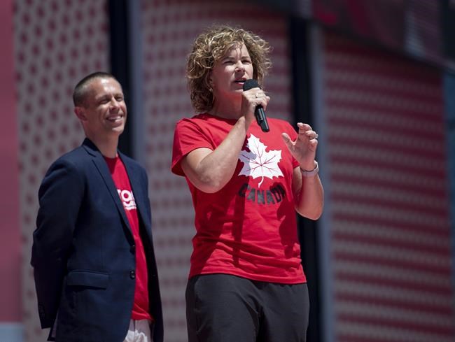 Marnie McBean speaks after being named the Olympic chef de mission for the Tokyo 2020 Summer Games during the Canada Day noon show on Parliament Hill in Ottawa on Monday, July 1, 2019. McBean has a message for Canada's Olympic athletes: however they navigate these turbulent times will be part of a story they'll tell for the rest of their lives.Friday marks one year out from the opening ceremonies of the rescheduled Tokyo Olympics, and the three-time Olympic gold medallist in rowing and Canada's chef de mission for Tokyo, wrote a letter to the Canadian team. THE CANADIAN PRESS/Justin Tang