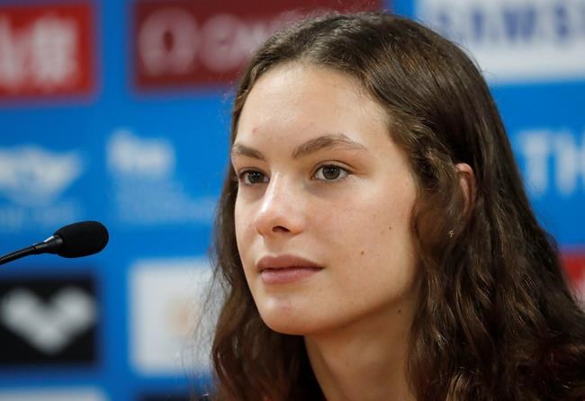 Canadian swimmer Penny Oleksiak answers questions during a press conference at the World Swimming Championships in Gwangju, South Korea, Friday, July 19, 2019. After a whirlwind few days, Canadian athletes now have a target on the distant horizon which is the Tokyo 2021 Games. THE CANADIAN PRESS/AP/Lee Jin-man