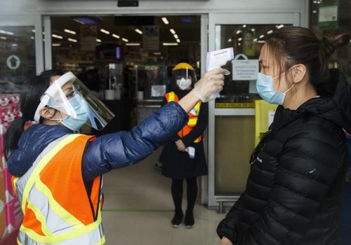 People get their temperatures tested at the T&T grocery store to help curb to spread of COVID-19 in Markham, Ont., on Monday, April 20, 2020. Only a few months ago they looked like something out of a sci-fi film, but fever scanners are now becoming regulation for some Canadian businesses such as Air Canada in the battle against COVID-19.Running a fever? You're grounded. THE CANADIAN PRESS/Nathan Denette