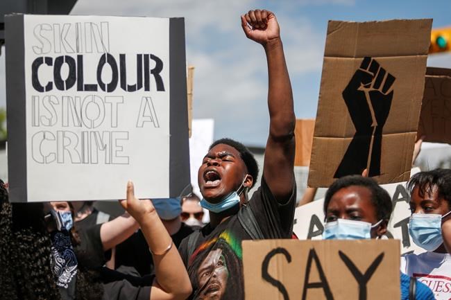 Protesters gather in solidarity with the George Floyd protests across the United States in Calgary, Alta., Wednesday, June 3, 2020. Demonstrators plan to march from Parliament Hill through Ottawa streets in mid-afternoon today to honour black lives lost at the hands of police. THE CANADIAN PRESS/Jeff McIntosh