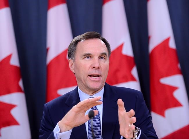 Minister of Finance Bill Morneau takes part in a press conference at the National Press Theatre in Ottawa on Friday, March 13, 2020. THE CANADIAN PRESS/Sean Kilpatrick