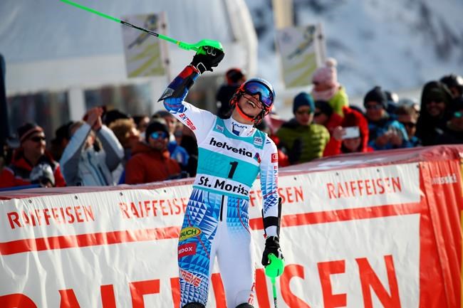 Slovakia's Petra Vlhova celebrates at the finish area of an alpine ski, women's parallel slalom World Cup in St. Moritz, Switzerland, Sunday, Dec. 15, 2019. (AP Photo/Sergio Bisi)