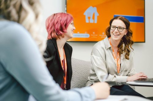 SkipTheDishes employees working together at their head office in Winnipeg.