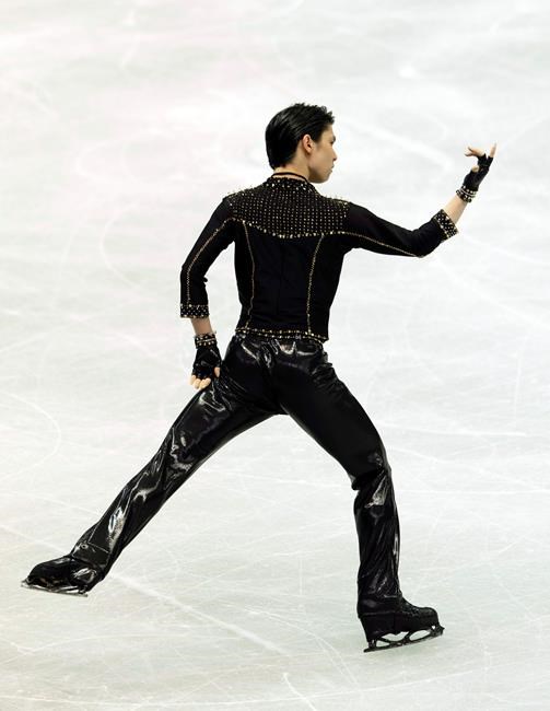 Japan's Yuzuru Hanyu performs during the men's short program of the ISU World Team Trophy figure skating competition in Osaka, western Japan, Thursday, April 15, 2021. (AP Photo/Hiro Komae)