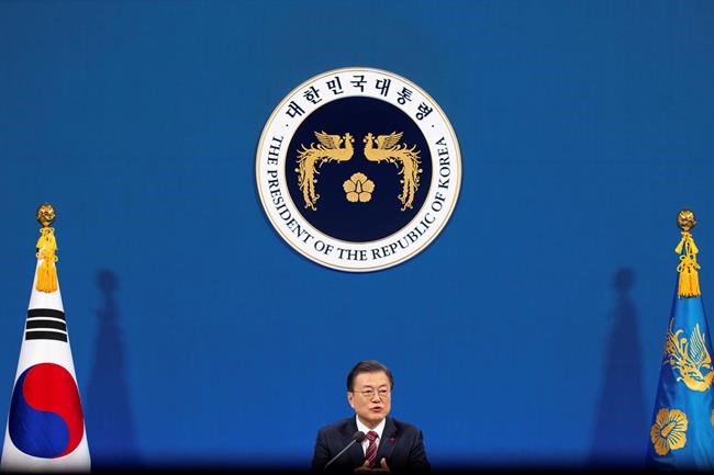 South Korean President Moon Jae-in speaks during an on-line New Year press conference with local and foreign journalists at the Presidential Blue House in Seoul, South Korea Monday, Jan. 18, 2021. (Jeon Heon-kyun/Pool Photo via AP)