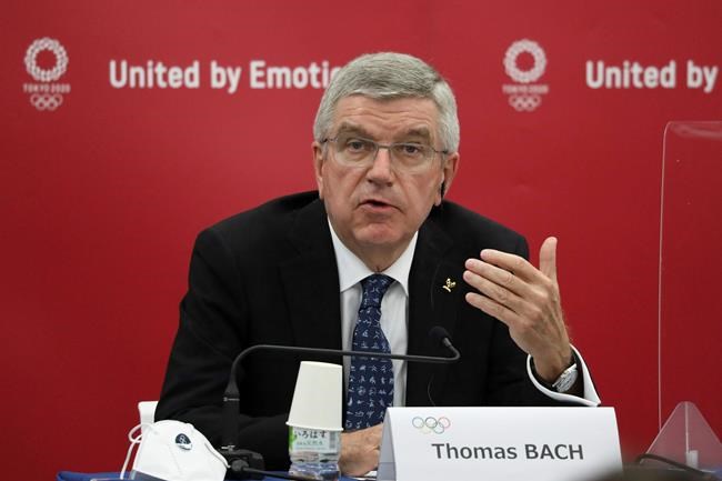 FILE - In this Nov. 16, 2020, file photo, Thomas Bach, International Olympic Committee (IOC) President, speaks during the joint press conference between IOC and Tokyo Organizing Committee of the Olympic and Paralympic Games (Tokyo 2020) in Tokyo, Japan. The International Olympic Committee is pushing back against reports that the postponed Tokyo Olympics will be canceled and will not open on July 23. The Tokyo Games were postponed 10 months ago at the outbreak of the coronavirus pandemic, and now their future appears threatened again.(Du Xiaoyi/Pool Photo via AP, File)