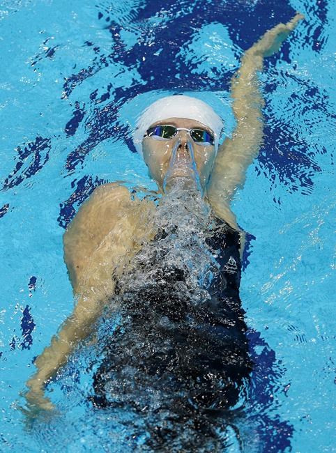FILE - In this Aug. 31, 2012, file photo, Australia's Ellie Cole swims in the women's 100m Backstroke S9 category at the 2012 Paralympics, in London. Cole is among several Paralympic athletes who are profiled in the Nexflix documentary “Rising Phoenix” that will be released in 190 countries on Wednesday, Aug. 26, 2020.(AP Photo/Kirsty Wigglesworth, File)