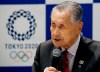 Tokyo 2020 Organizing Committee President Yoshiro Mori delivers a speech during the Tokyo 2020 Executive Board Meeting in Tokyo, Japan Monday, March 30, 2020. Mori said Monday he expects to talk with IOC President Thomas Bach this week about rescheduling the games for next year. (Issei Kato/Pool Photo via AP)