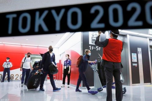 The Olympic athletes from the United States arrive at Narita International Airport in Narita, east of Tokyo, on July 1, 2021. Tens of thousands of visiting athletes, officials and media are descending on Japan for a Summer Olympics unlike any other. There will be no foreign fans, no local fans in Tokyo-area venues. A surge of virus cases has led to yet another state of emergency. (Kyodo News via AP)