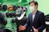 Fencing instructor Hiroshi Kato speaks during an interview with The Associated Press in Tokyo on June 21, 2021. Kato said he worries that he’ll lose even more business than he did during the coronavirus pandemic because he’s been ordered to move from the building where he works across from the main Olympics stadium from July 1 to Sep. 19, for unspecified security reasons. (AP Photo/Koji Sasahara)