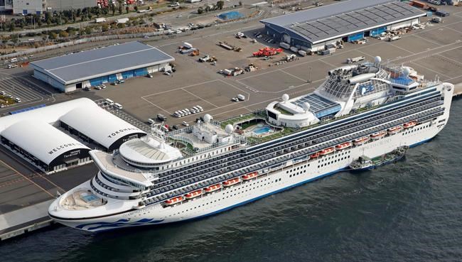 The cruise ship Diamond Princess is docked at Yokohama Port, near Tokyo, Friday, Feb. 7, 2020. Japan on Friday reported 41 new cases of a virus on the cruise ship that's been quarantined. About 3,700 people have been confined aboard the ship. (Sadayuki Goto/Kyodo News via AP)