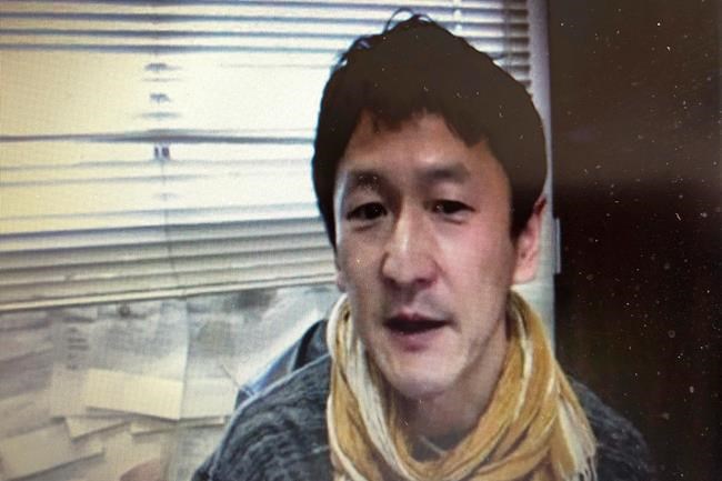 In this screen shot image made from a video news conference by Foreign Correspondents' Club of Japan (FCCJ) in Tokyo, Japanese professor Kentaro Iwata speaks Monday, April 20, 2020. Iwata says he is “very pessimistic” the Olympics can be held next year in Japan. (FCCJ via AP)