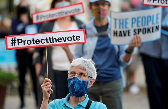 Protesters gather at a protect the vote rally in downtown San Antonio, Wednesday, Nov. 4, 2020. (AP Photo/Eric Gay)