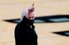 San Antonio Spurs coach Gregg Popovich signals to players during the first half of an NBA basketball game against the Denver Nuggets in San Antonio, Friday, Jan. 29, 2021. (AP Photo/Eric Gay)