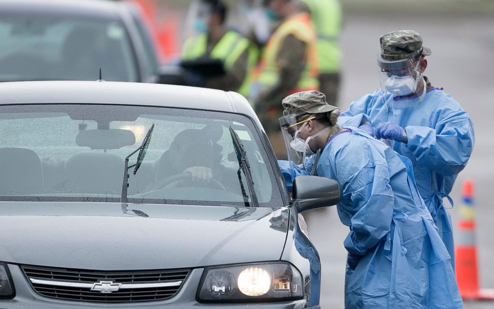 North Dakota National Guard troops conduct COVID-19 testing in Grand Forks at a drive-thru mass testing site. (Eric Hylden / Grand Forks Herald files)