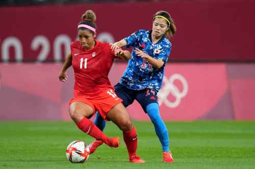 AP
Canada's Desiree Scott (11) controls the ball against Japan's Yui Hasegawa (14) during a women's soccer match at the 2020 Summer Olympics, Wednesday, July 21, 2021, in Sapporo, Japan. (AP Photo/Silvia Izquierdo)