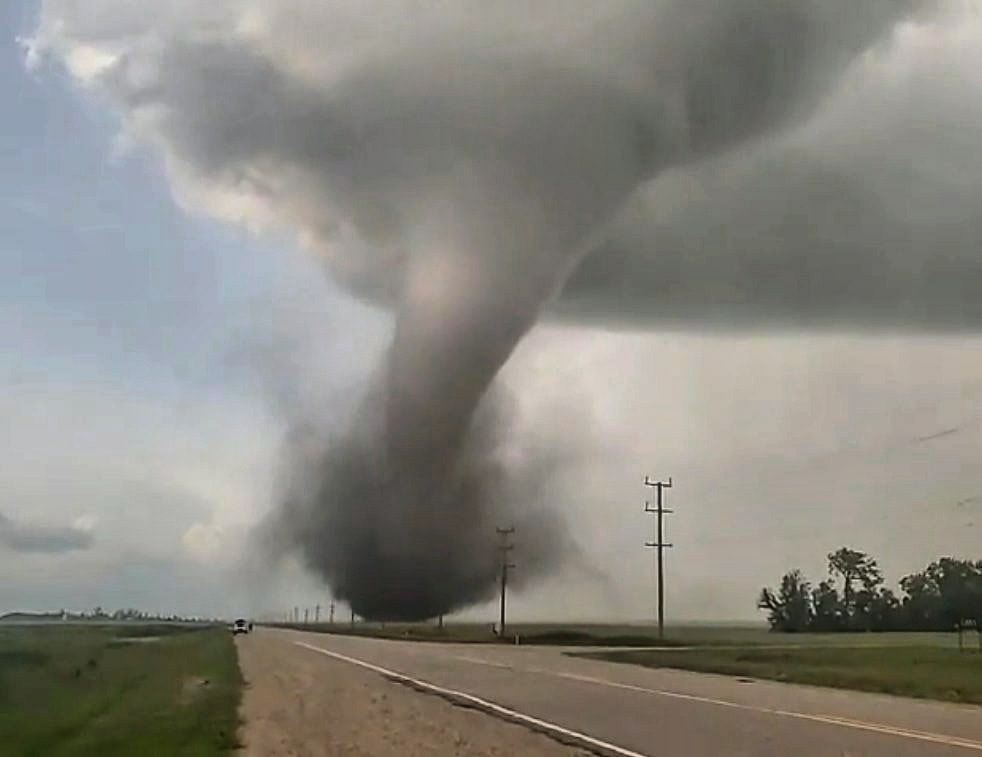 A tornado is seen touching down southwest of Virden on Friday evening. (Submitted)