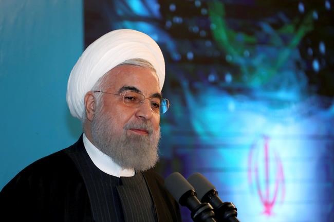 In this photo released by the official website of the office of the Iranian Presidency, President Hassan Rouhani speaks in a ceremony inaugurating a new highway that connects Tehran to the north of the country, Iran, Tuesday, Feb. 25, 2020. Rouhani sought to reassure the nation in a speech on Tuesday, calling the new coronavirus an