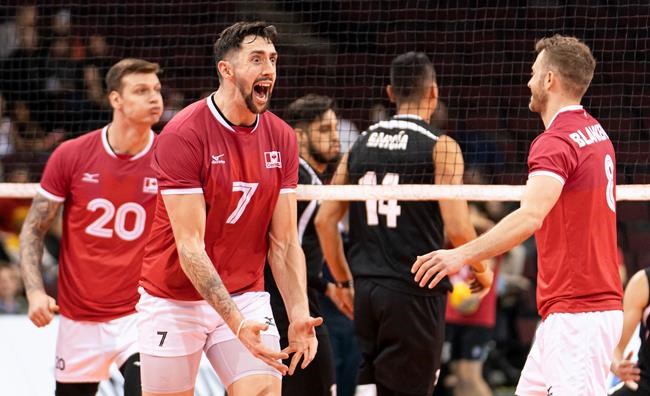 Canada's Stephen Maar (middle) celebrates after scoring a point against Mexico during the men's 2020 Olympic qualification tournament at the Pacific Coliseum in Vancouver, on Friday, January 10, 2020. THE CANADIAN PRESS/Richard Lam