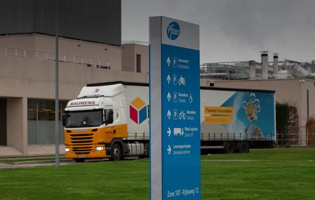 A truck leaves Pfizer Manufacturing in Puurs, Belgium, on Wednesday, Dec. 2, 2020. British officials authorized a COVID-19 vaccine for emergency use on Wednesday, greenlighting the world's first shot against the virus that's backed by rigorous science and taking a major step toward eventually ending the pandemic. (AP Photo/Virginia Mayo)