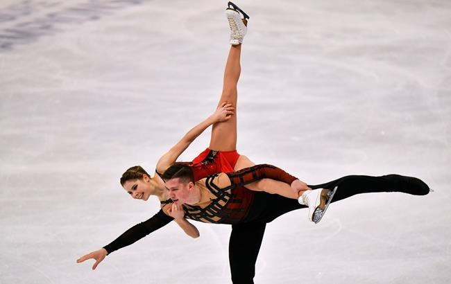 Russian pair Anastasia Mishina and Aleksandr Galliamov perform during the Pairs Free Skating at the Figure Skating World Championships in Stockholm, Sweden, Thursday, March 25, 2021. (AP Photo/Martin Meissner)