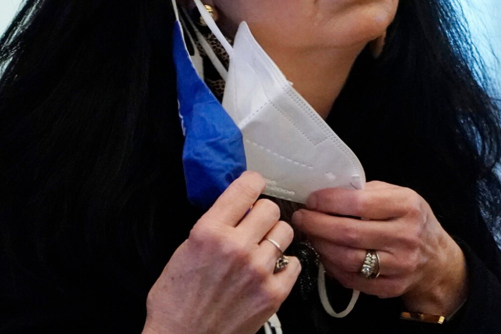 CP
Some people have been doubling up their masks in the belief it could be more effective than just one. (Rogelio V. Solis / The Associated Press)