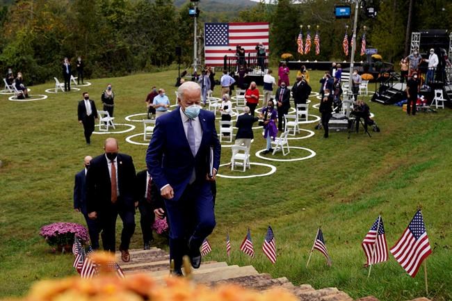 FILE - In this Oct. 27, 2020, file photo, then-Democratic presidential candidate former Vice President Joe Biden leaves after speaking at Mountain Top Inn & Resort in Warm Springs, Ga. President-elect Joe Biden has evoked Franklin Delano Roosevelt in promising a remaking of America unseen since the New Deal. Pledging to emulate some of the loftiest reforms in the nation’s history has left him with towering promises to keep. And Biden hopes to deliver against the backdrop of the pandemic and searing national division. (AP Photo/Andrew Harnik, file)