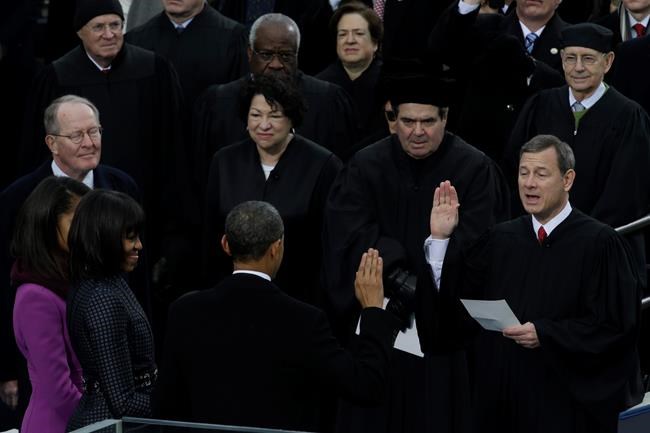 FILE - In this Jan. 21, 2013, file photo Chief Justice John Roberts, right, reads the oath of office to President Barack Obama at the ceremonial swearing-in at the U.S. Capitol during the 57th Presidential Inauguration in Washington. (AP Photo/Paul Sancya, File)