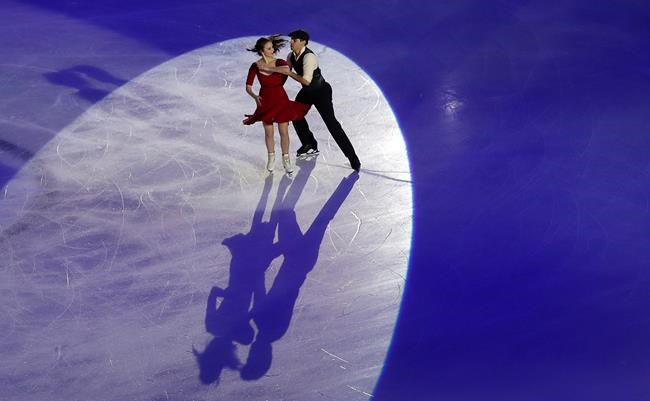 Skaters perform during the opening ceremony of the figure skating Grand Prix finals at the Palavela ice arena, in Turin, Italy, Thursday, Dec. 5, 2019. (AP Photo/Antonio Calanni)