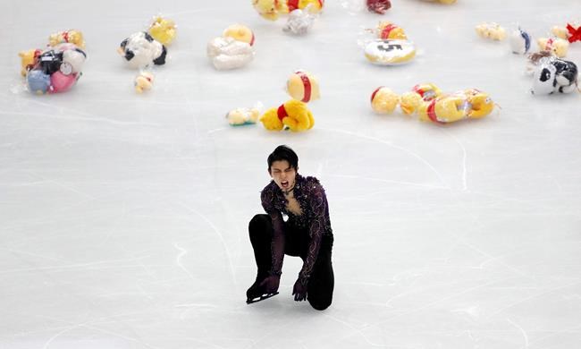 Japan's Yuzuru Hanyu celebrates after competing in the men's free skating during the figure skating Grand Prix finals at the Palavela ice arena, in Turin, Italy, Saturday, Dec. 7, 2019. (AP Photo/Antonio Calanni)