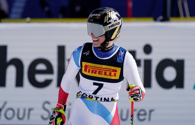 Switzerland's Lara Gut-Behrami smiles as she arrives at the finish area during the women's super-G, at the alpine ski World Championships in Cortina d'Ampezzo, Italy, Thursday, Feb. 11, 2021. (AP Photo/Giovanni Auletta)
