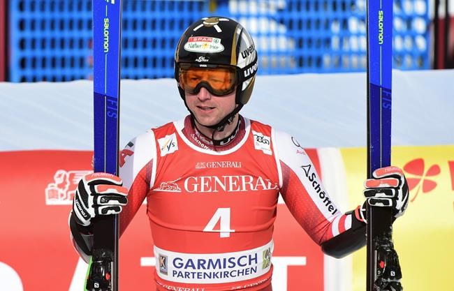 Austria's Hannes Reichelt reacts as he arrives at the finish area during an alpine ski, men's World Cup super-G race in Garmisch-Partenkirchen, Germany, Saturday, Feb. 6, 2021. (AP Photo/Marco Tacca)