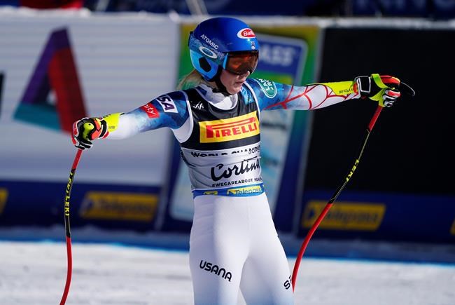 United States' Mikaela Shiffrin celebrates as she arrives at the finish area during the women's super-G, at the alpine ski World Championships in Cortina d'Ampezzo, Italy, Thursday, Feb. 11, 2021. (AP Photo/Giovanni Auletta)