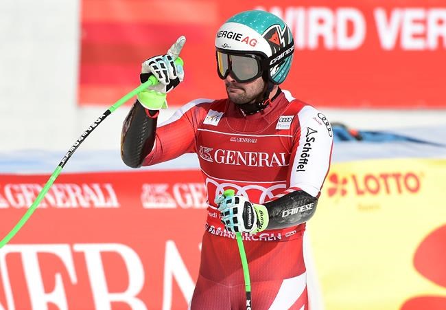 Austria's Vincent Kriechmayr celebrates as he arrives at the finish area during an alpine ski, men's World Cup super-G race in Garmisch-Partenkirchen, Germany, Saturday, Feb. 6, 2021. (AP Photo/Marco Tacca)