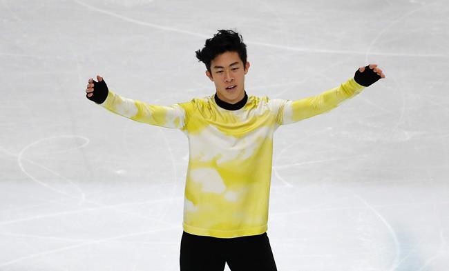 United States' Nathan Chen celebrates after competing in the men's free skating during the figure skating Grand Prix finals at the Palavela ice arena, in Turin, Italy, Saturday, Dec. 7, 2019. (AP Photo/Antonio Calanni)