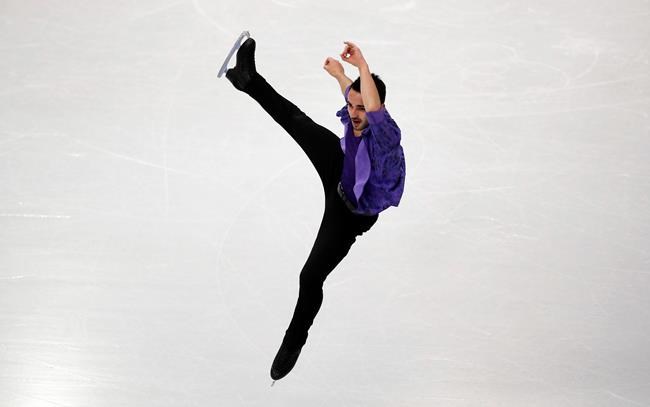 France's Kevin Aymoz competes in the men's short program during the figure skating Grand Prix finals at the Palavela ice arena, in Turin, Italy, Thursday, Dec. 5, 2019. (AP Photo/Antonio Calanni)