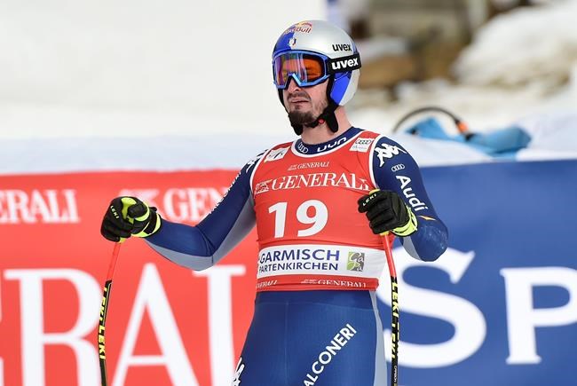 Italy's Dominik Paris reacts as he arrives at the finish area during an alpine ski, men's World Cup super-G race in Garmisch-Partenkirchen, Germany, Saturday, Feb. 6, 2021. (AP Photo/Marco Tacca)