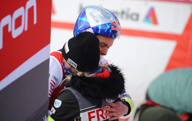France's Alexis Pinturault celebrates with his wife after winning an alpine ski, World Cup men's giant slalom in Lenzerheide, Switzerland, Saturday, March 20, 2021. (AP Photo/Marco Trovati)