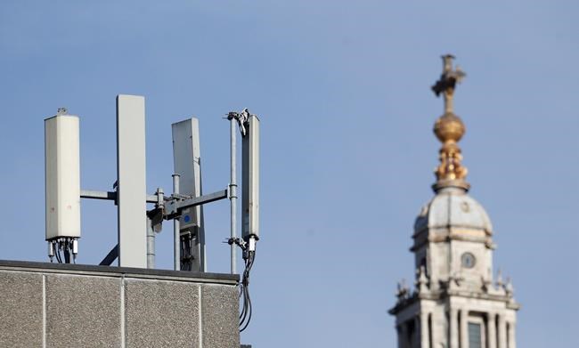 Mobile network phone masts are visible in front of St Paul's Cathedral in the City of London, Tuesday, Jan. 28, 2020.The Chinese tech firm Huawei has been designated a