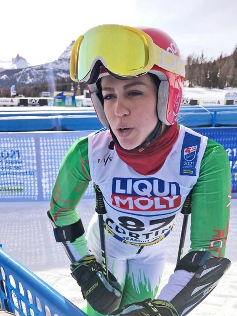 Iran's Forough Abbasi is interviewed in the finish area after the first run of a women's giant slalom, at the alpine ski World Championships, in Cortina d'Ampezzo, Italy, Thursday, Feb. 18, 2021. (AP Photo/Andrew Dumpf)