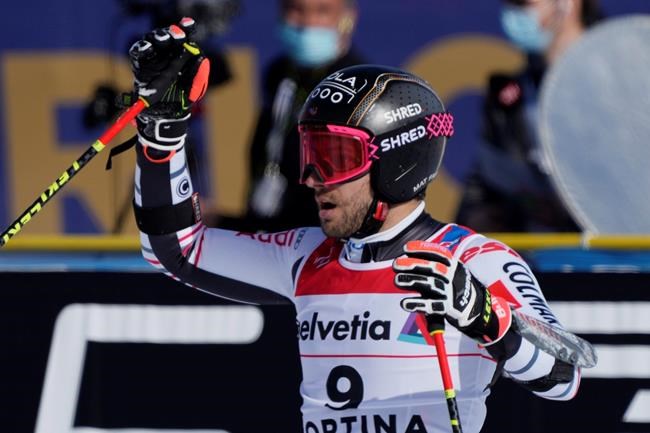 France's Mathieu Faivre celebrates winning the gold medal after completing a men's giant slalom, at the alpine ski World Championships, in Cortina d'Ampezzo, Italy, Friday, Feb. 19, 2021. (AP Photo/Giovanni Auletta)