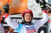Switzerland's Loic Meillard celebrates his victory in the finish area during an alpine ski, men's World Cup parallel giant slalom, in Chamonix, France, Sunday, Feb. 9, 2020. (AP Photo/Alessandro Trovati)
