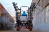 A worker in a tractor operates electrostatic spraying to disinfect the workplace following the coronavirus outbreak, in Yantai city in east China's Shandong province, Sunday, Feb. 9, 2020. China's virus death toll rose above 800, passing the number of fatalities in the 2002-2003 SARS epidemic, but fewer new cases were reported in a possible sign its spread may be slowing as other nations step up efforts to block the disease. (Chinatopix via AP)